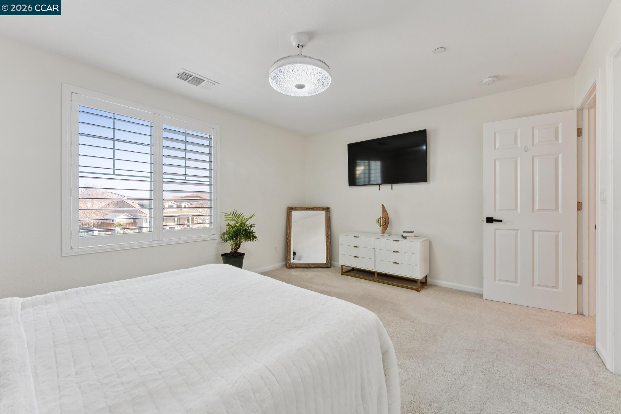 1226 Sierra Trail Road Oakley, CA 94561 - Photo 39 of 60 a bedroom with a bed and a flat screen tv