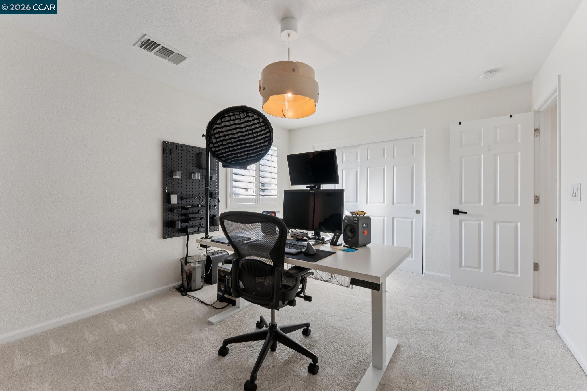 1226 Sierra Trail Road Oakley, CA 94561 - Photo 47 of 60 a view of a workspace with furniture