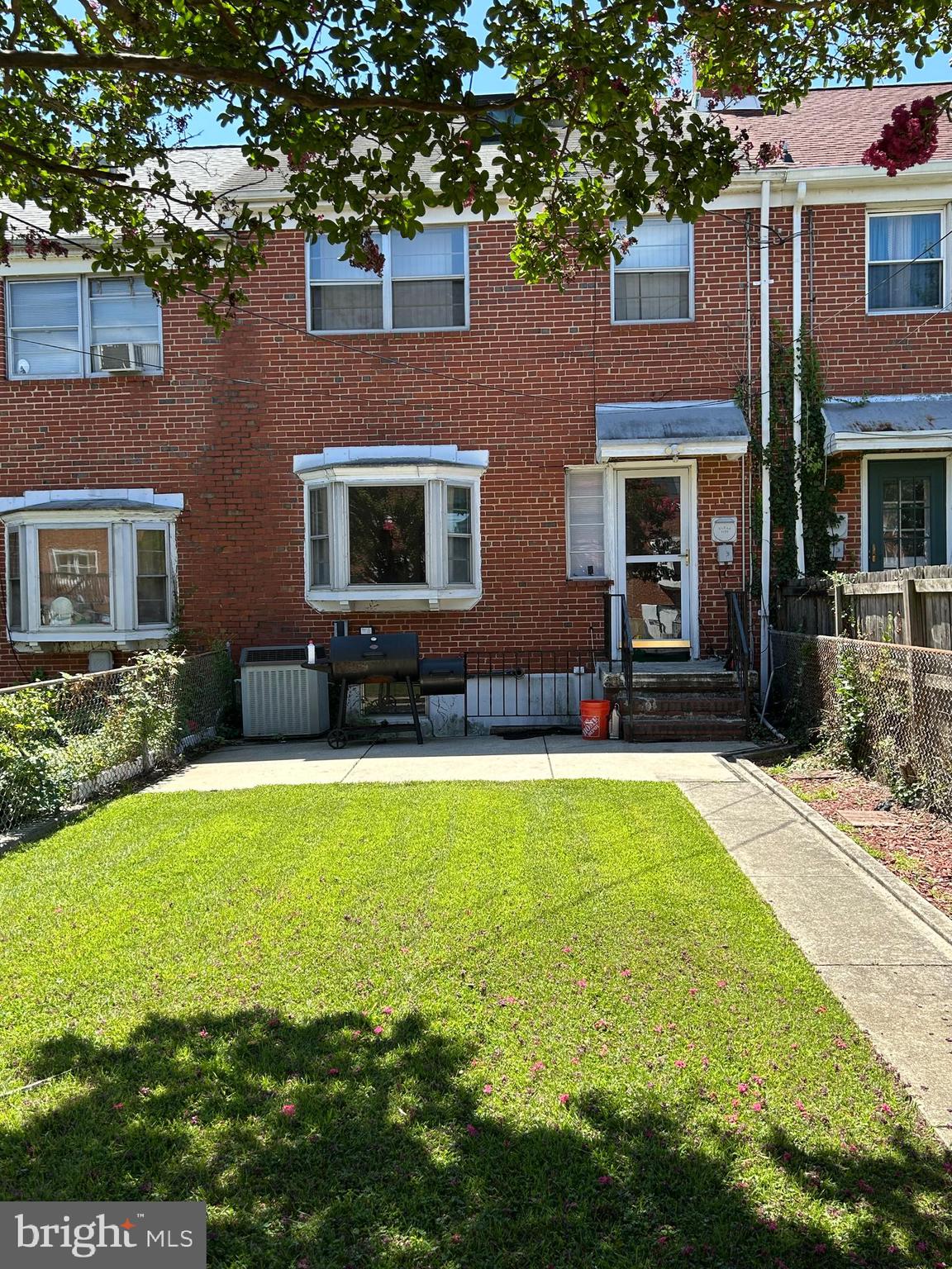 1804 Winford Road Baltimore, MD 21239 - Photo 16 of 18 a front view of a house with a yard