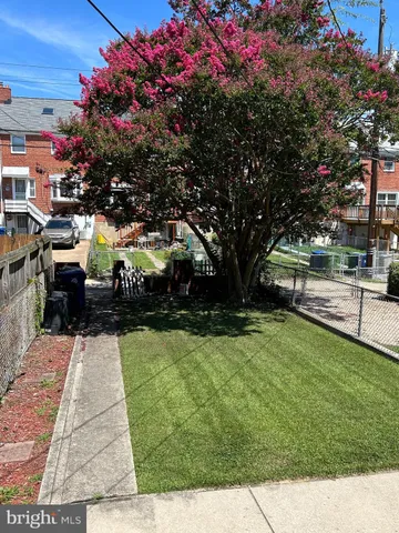 a view of a garden with houses