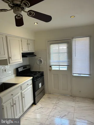 a kitchen with a cabinets and appliances