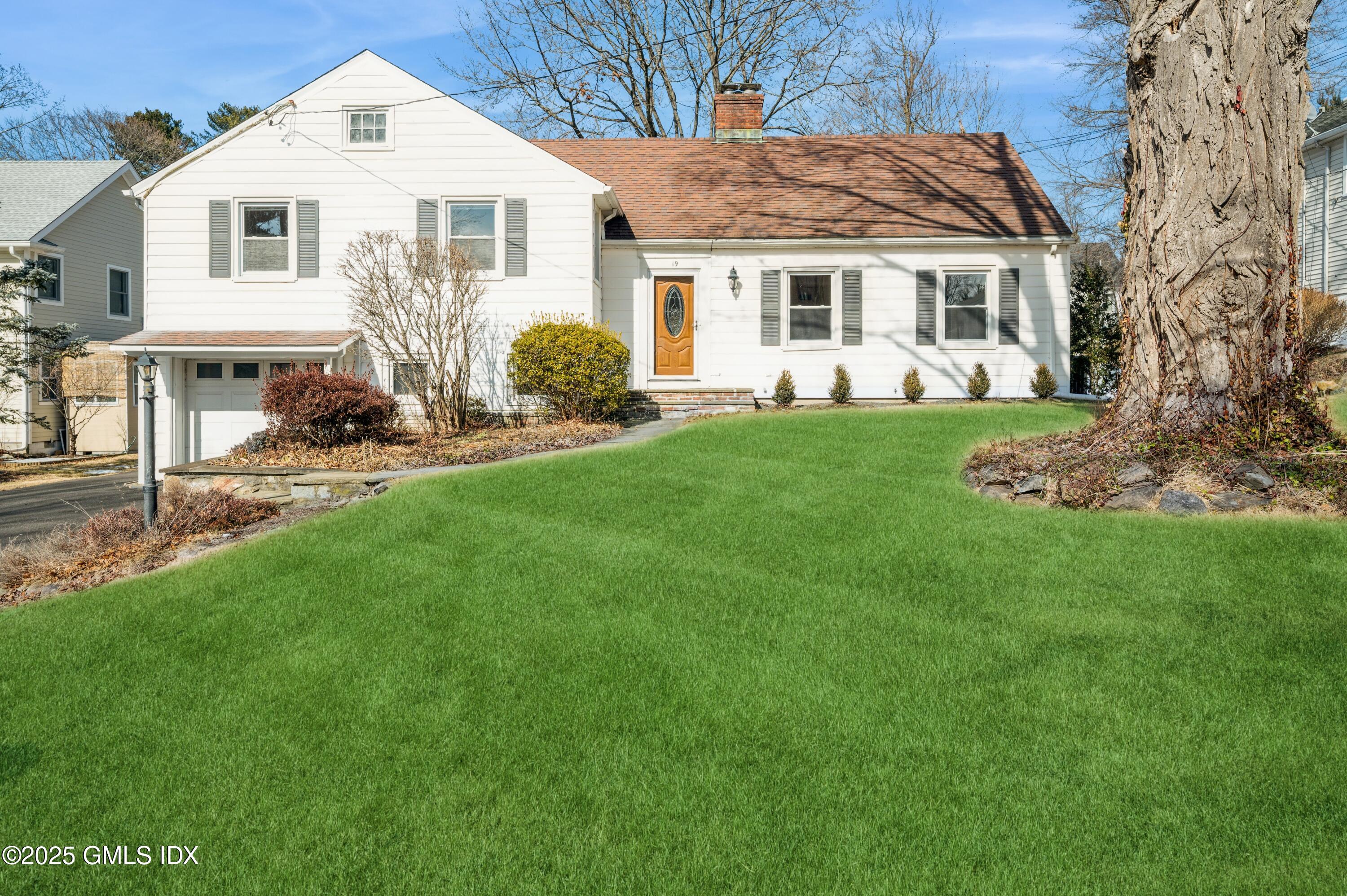 19 Bayside Terrace Riverside, CT 06878 - Photo 1 of 22 a view of house with a yard