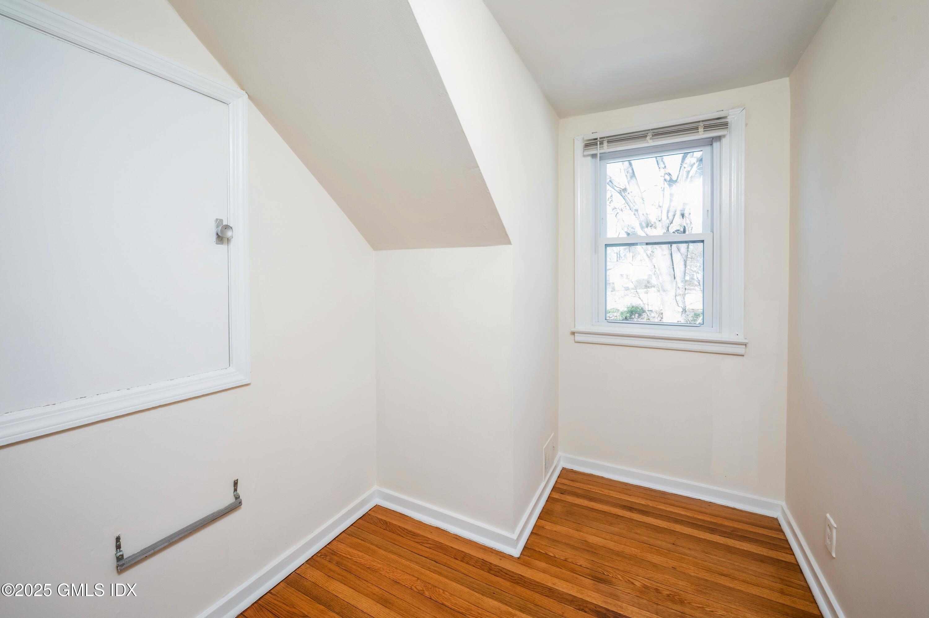 19 Bayside Terrace Riverside, CT 06878 - Photo 17 of 22 a view of room with window and wooden floor