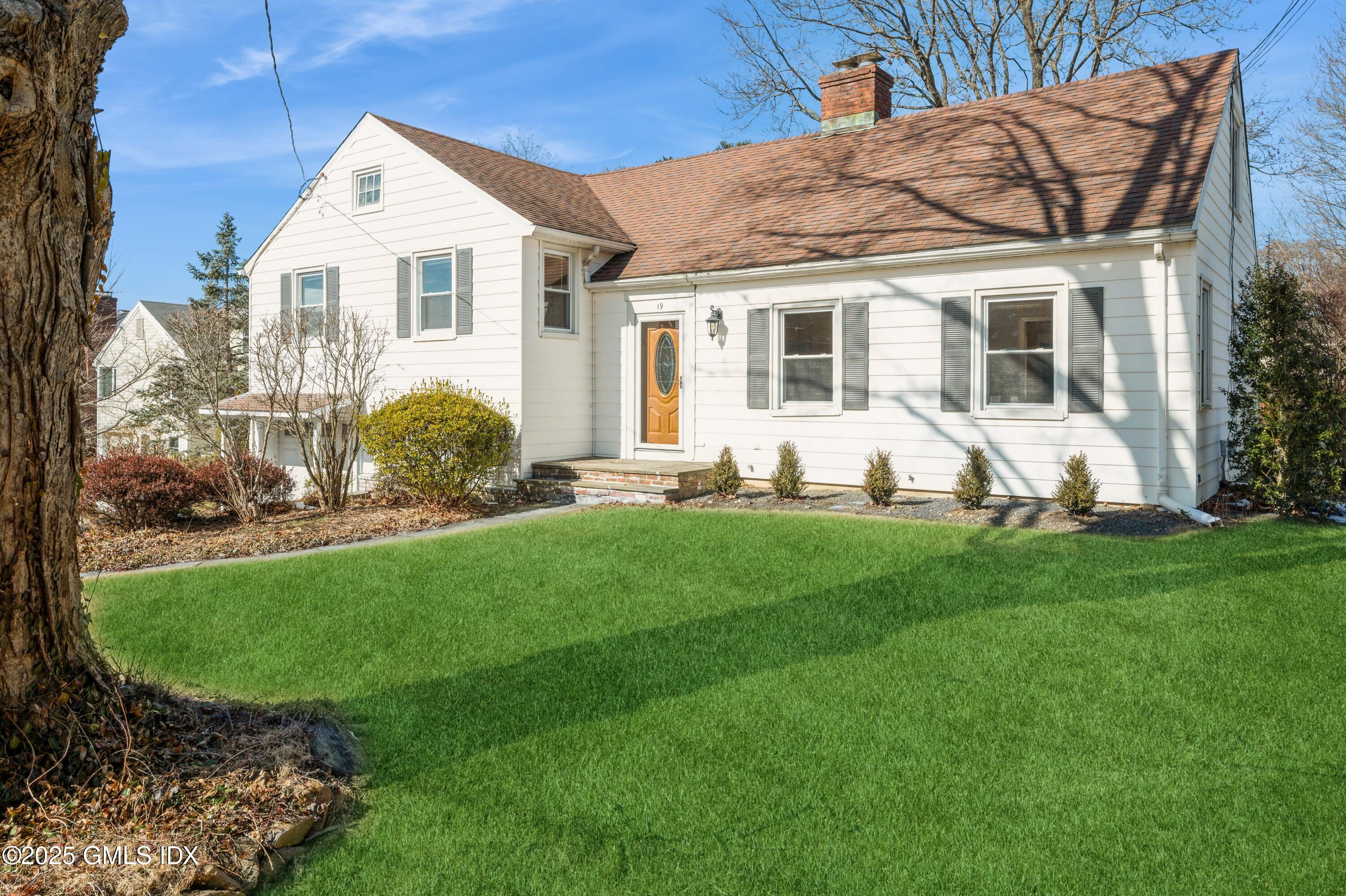 19 Bayside Terrace Riverside, CT 06878 - Photo 2 of 22 a view of a house with backyard sitting area and garden
