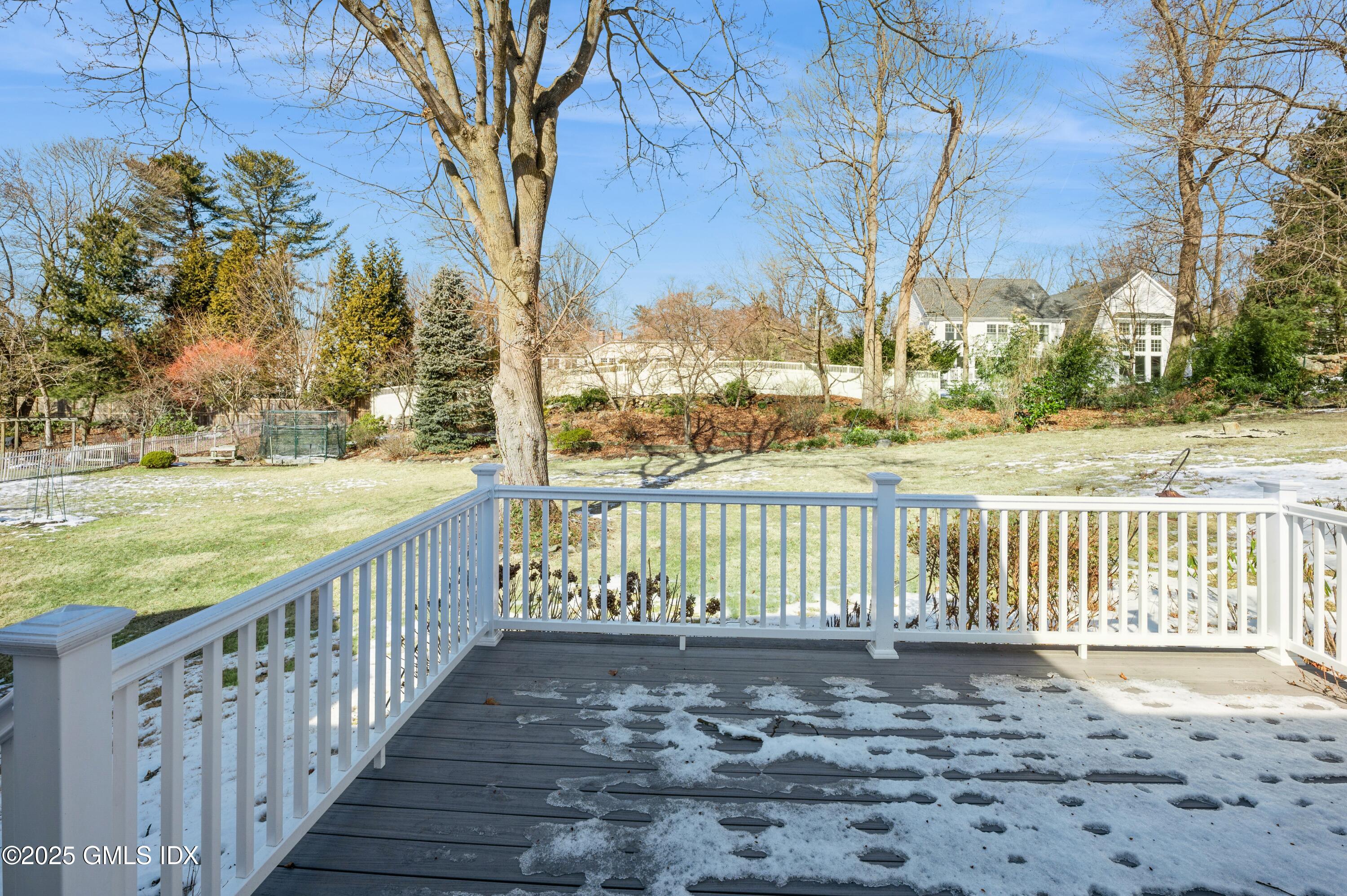 19 Bayside Terrace Riverside, CT 06878 - Photo 21 of 22 a view of a street with large trees and wooden fence