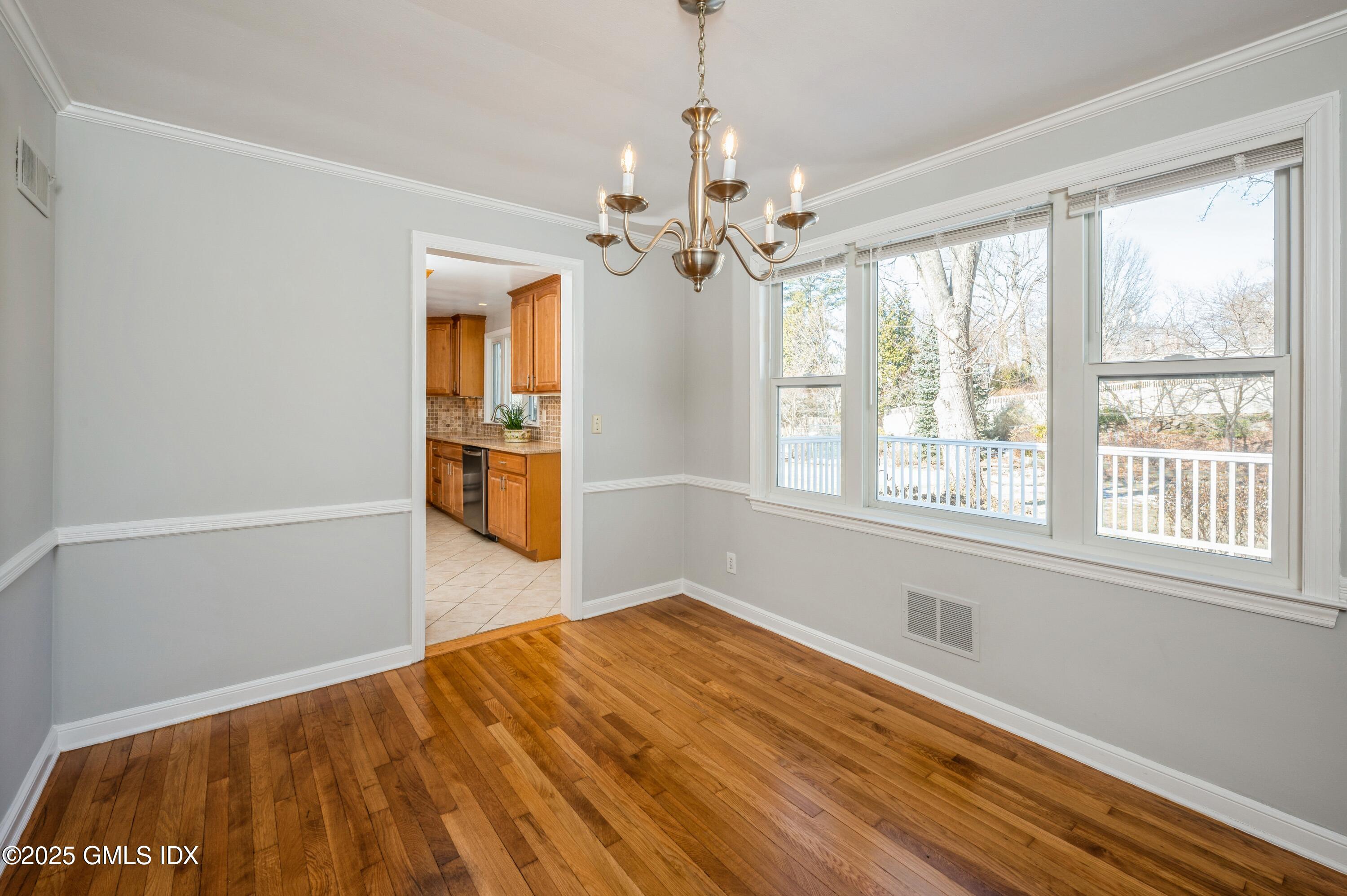 19 Bayside Terrace Riverside, CT 06878 - Photo 5 of 22 a view of empty room with wooden floor and fan