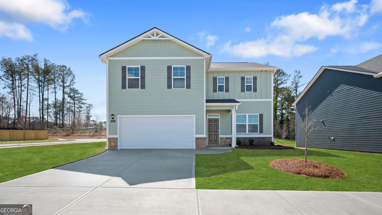 8578 Seabiscuit Road Lithonia, GA 30058 - Photo 1 of 30 a front view of a house with a yard and garage