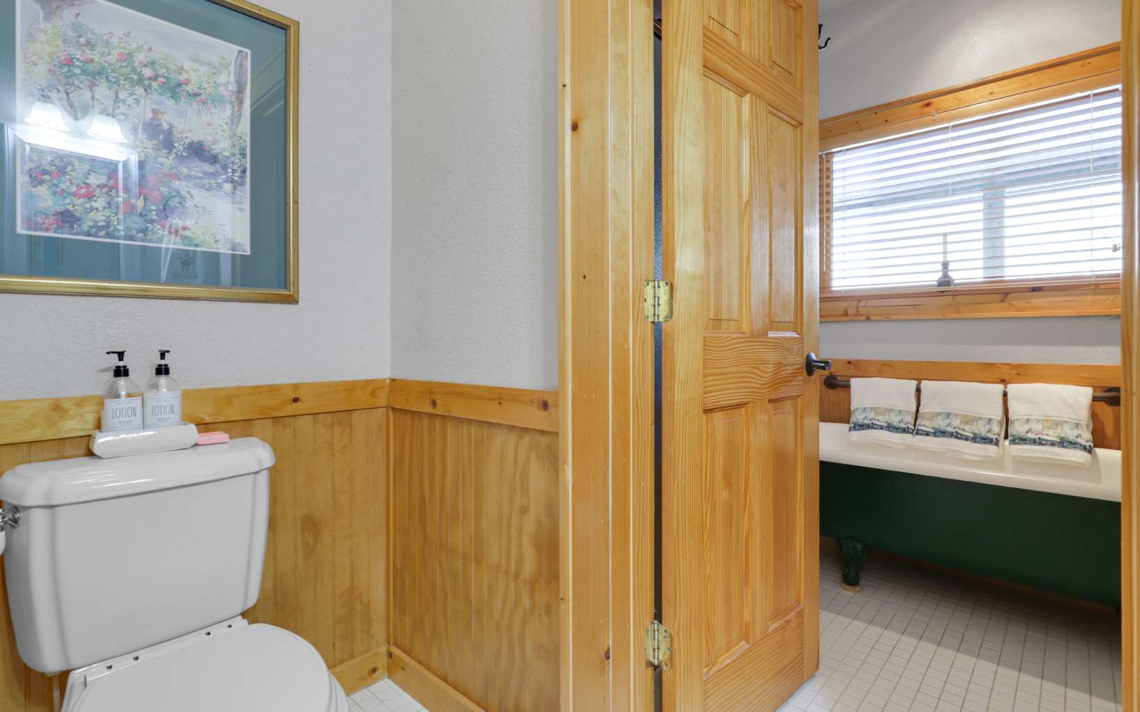303 Campbell Cove Road Turtletown, TN 37391 - Photo 19 of 44 a bathroom with a toilet a sink and a window