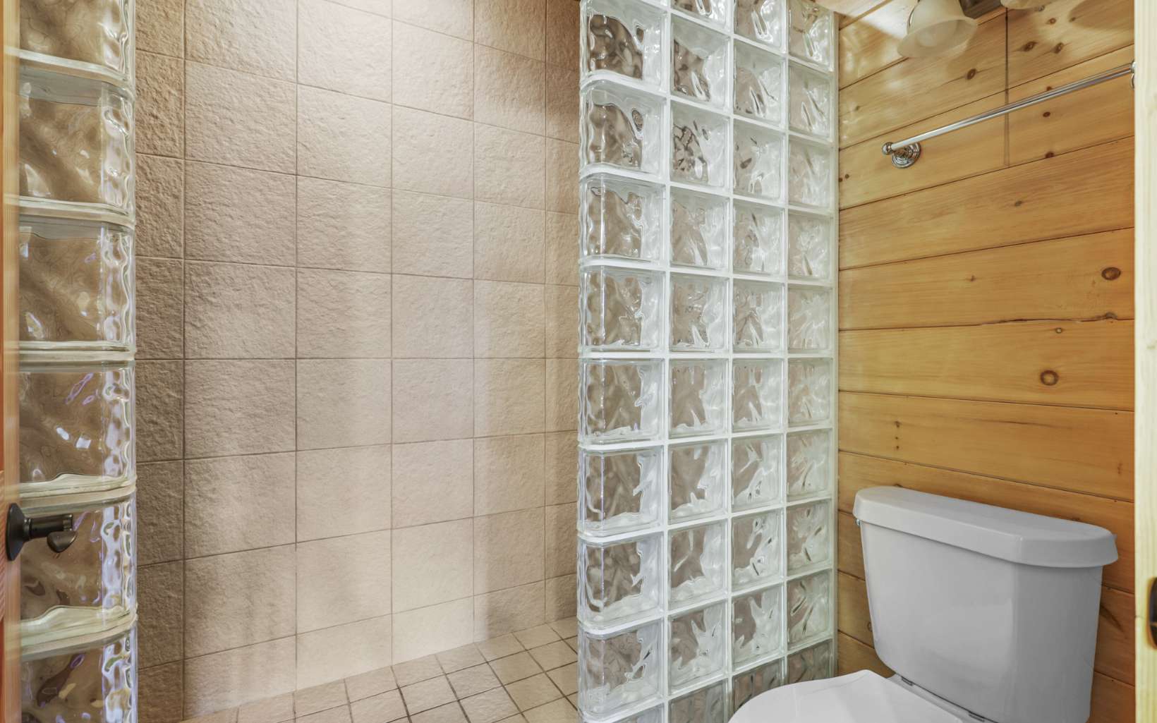 303 Campbell Cove Road Turtletown, TN 37391 - Photo 35 of 44 a bathroom with a toilet and a shower