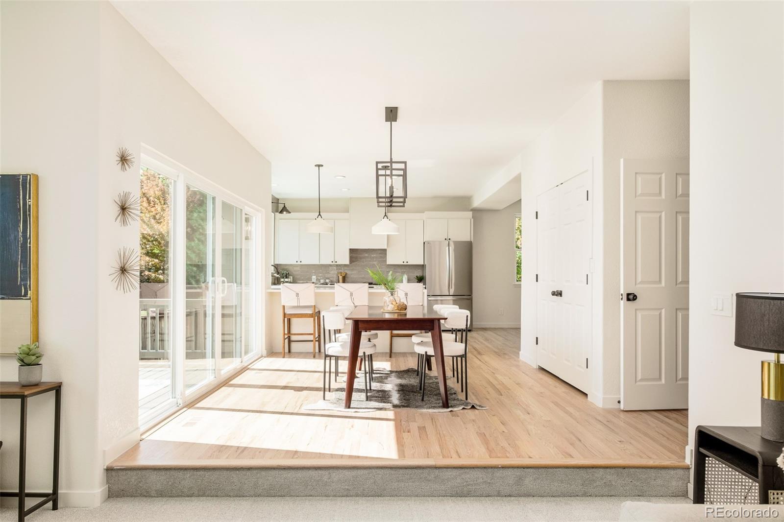 8176 Lone Oak Court Lone Tree, CO 80124 - Photo 12 of 50 a living room with furniture a rug and white walls
