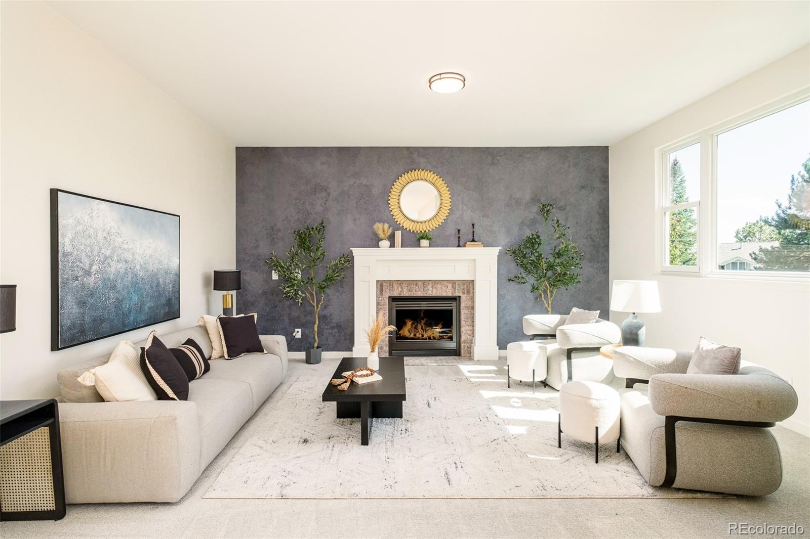 8176 Lone Oak Court Lone Tree, CO 80124 - Photo 14 of 50 a living room with furniture a fireplace and a large window