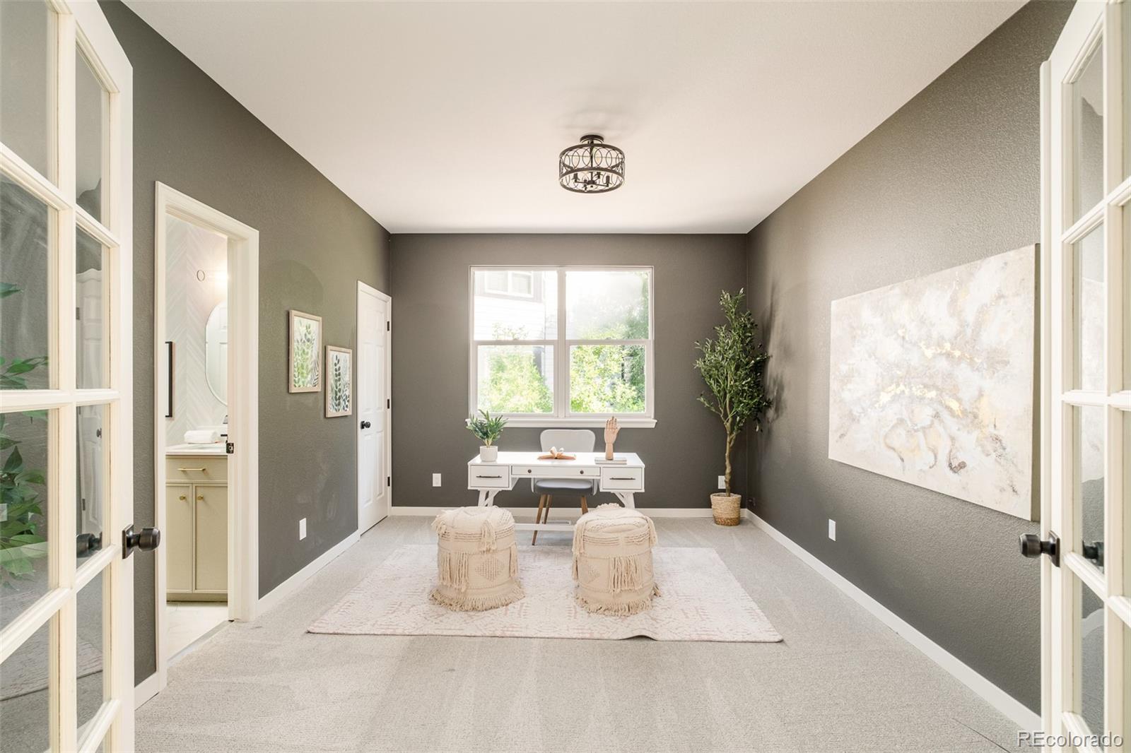 8176 Lone Oak Court Lone Tree, CO 80124 - Photo 15 of 50 a bedroom with a large bed and a large window