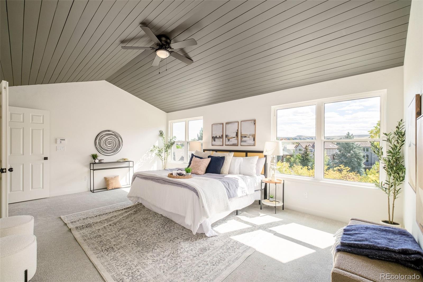 8176 Lone Oak Court Lone Tree, CO 80124 - Photo 21 of 50 a bedroom with a large bed and a window