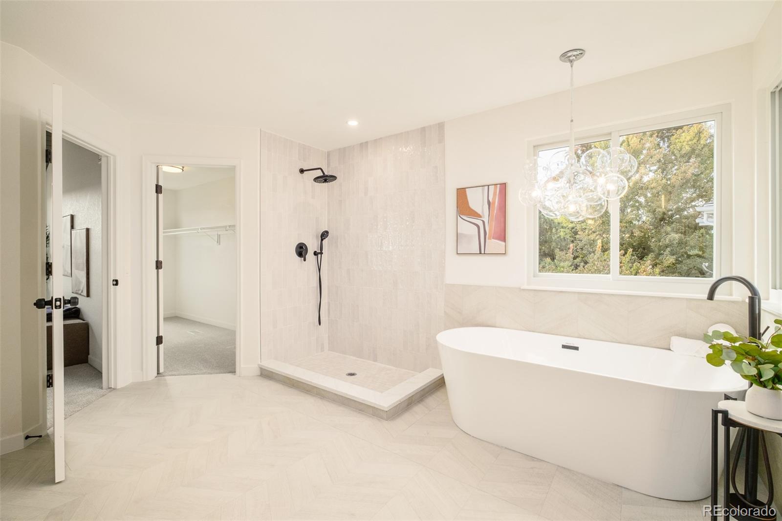 8176 Lone Oak Court Lone Tree, CO 80124 - Photo 23 of 50 a bathroom with a tub a sink and a shower