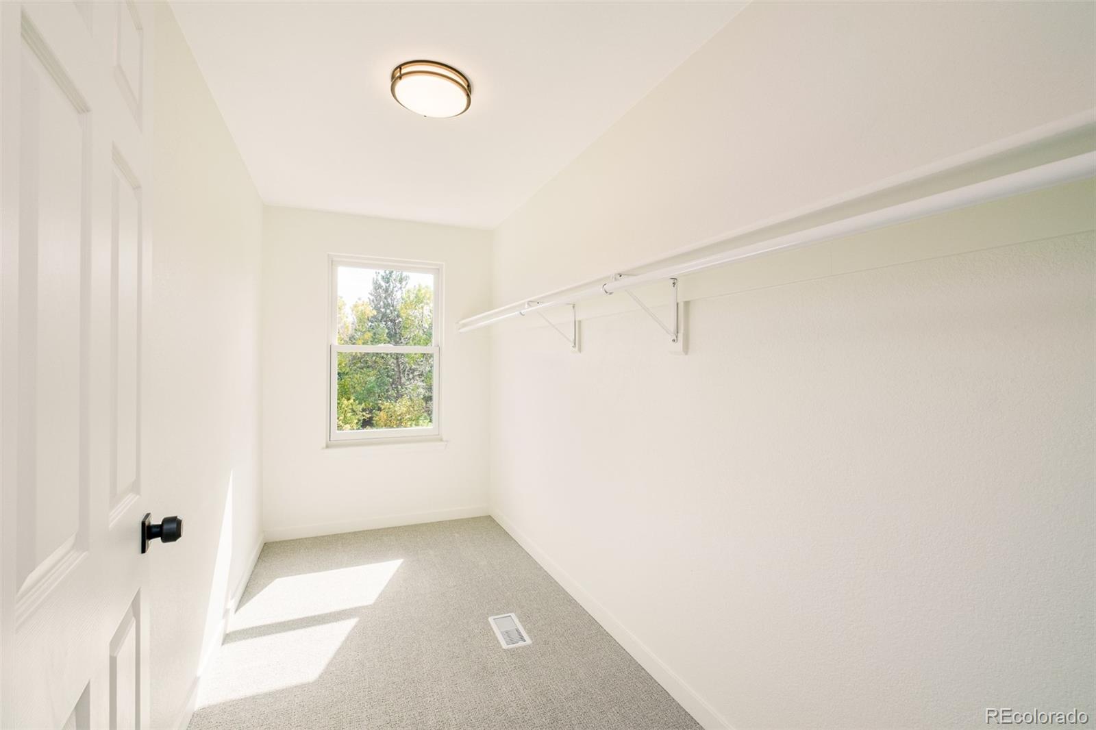 8176 Lone Oak Court Lone Tree, CO 80124 - Photo 27 of 50 a view of a small space with wooden floor and a window