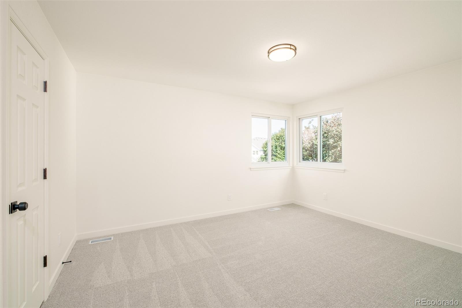 8176 Lone Oak Court Lone Tree, CO 80124 - Photo 28 of 50 an empty room with windows