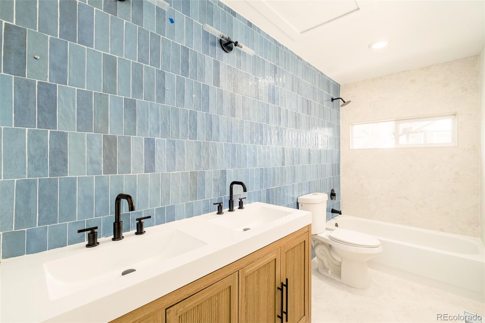 8176 Lone Oak Court Lone Tree, CO 80124 - Photo 29 of 50 a bathroom with a sink and a mirror