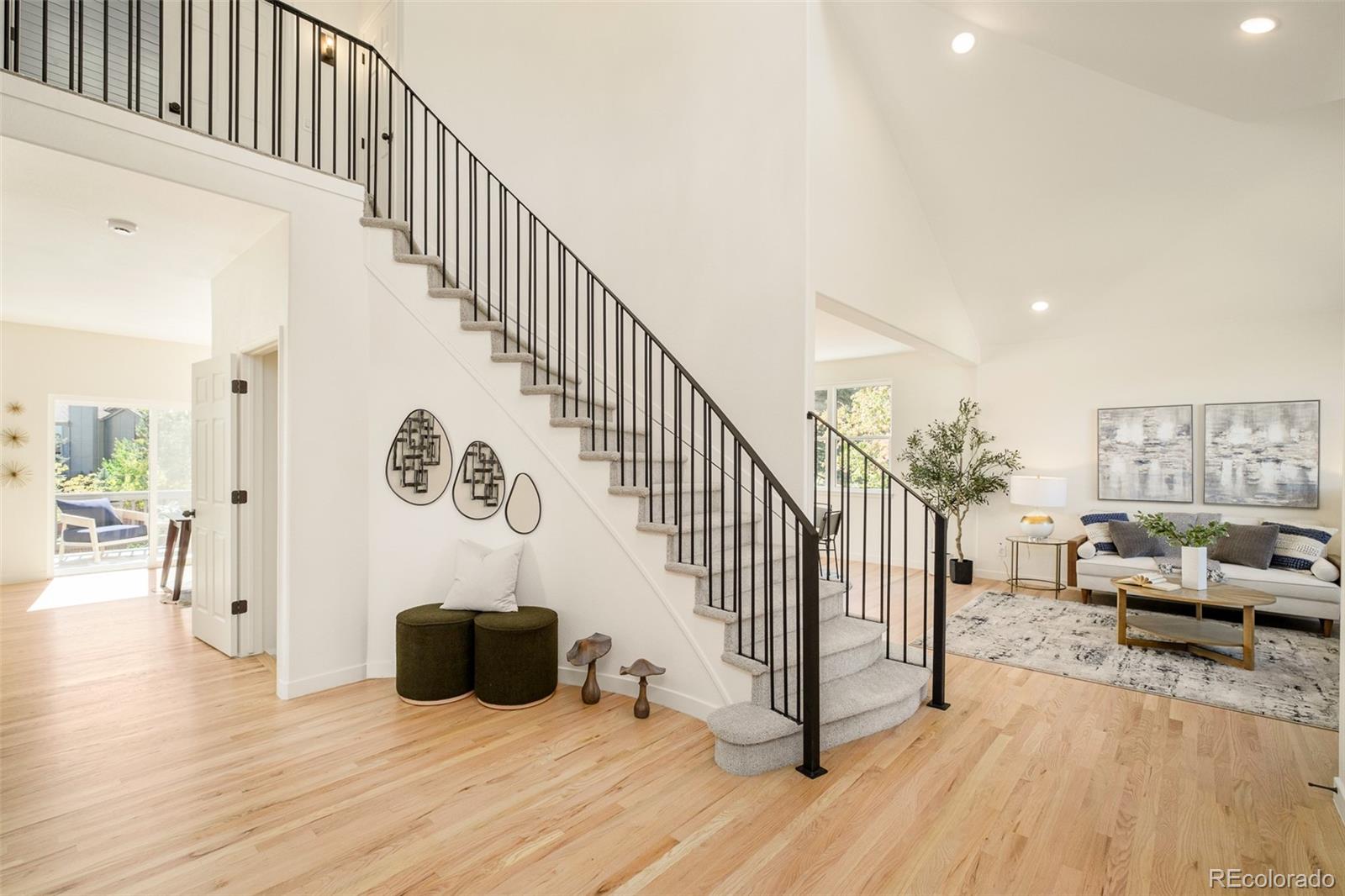8176 Lone Oak Court Lone Tree, CO 80124 - Photo 3 of 50 a view of a livingroom with wooden floor and furniture