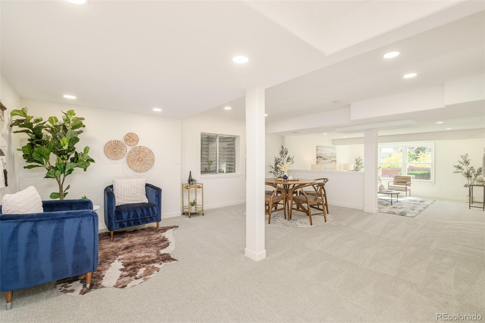 8176 Lone Oak Court Lone Tree, CO 80124 - Photo 33 of 50 a living room with furniture and a large window