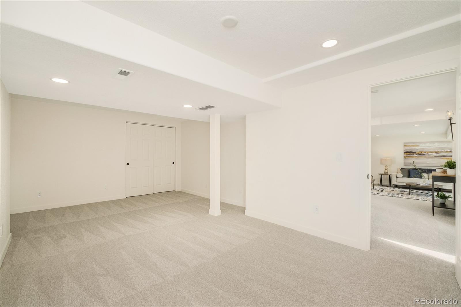 8176 Lone Oak Court Lone Tree, CO 80124 - Photo 34 of 50 an empty room with kitchen view and a sink