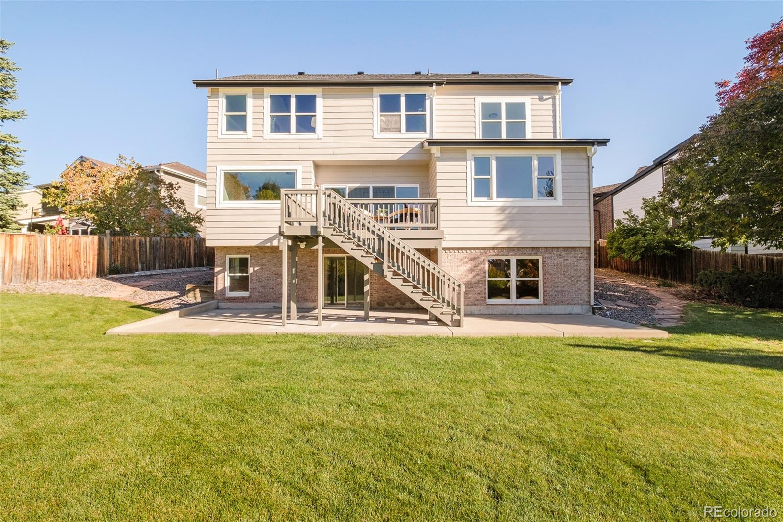 8176 Lone Oak Court Lone Tree, CO 80124 - Photo 38 of 50 a view of a house with pool and chairs