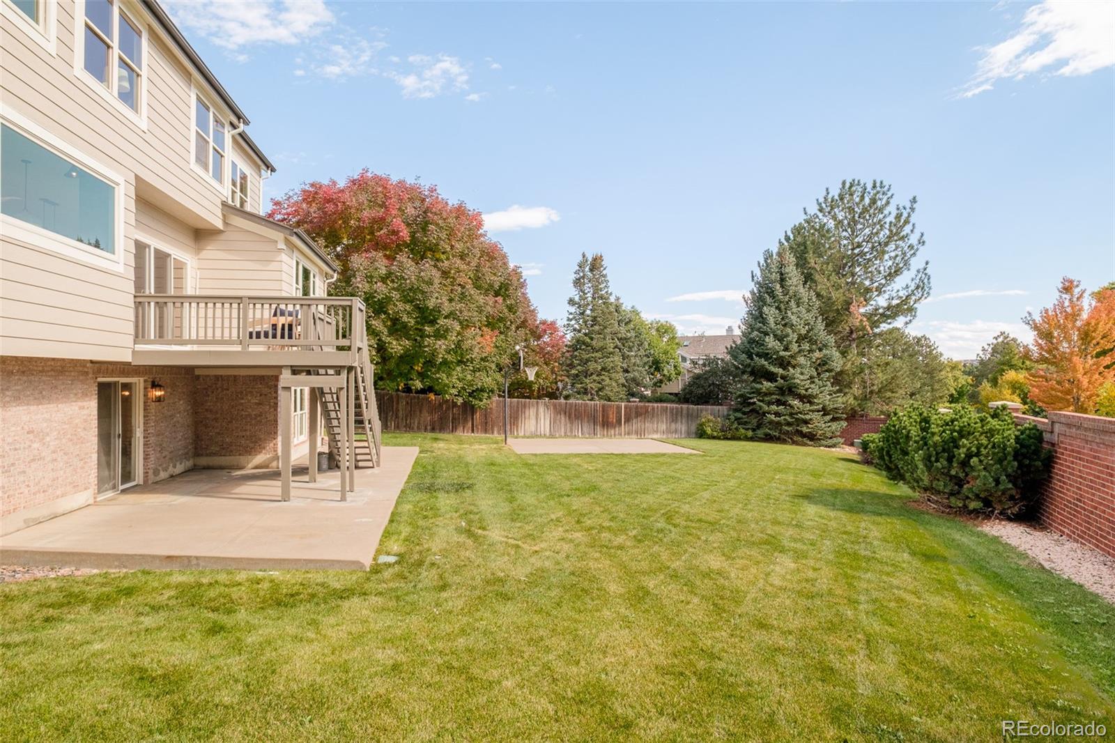 8176 Lone Oak Court Lone Tree, CO 80124 - Photo 39 of 50 a swimming pool with outdoor seating and yard