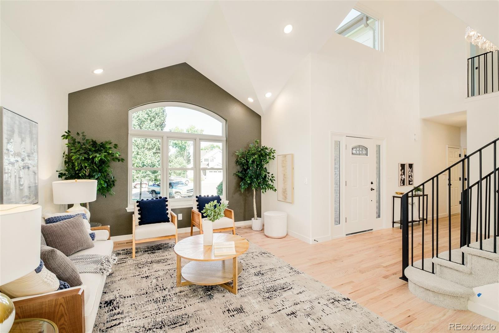 8176 Lone Oak Court Lone Tree, CO 80124 - Photo 4 of 50 a living room with furniture and a large window