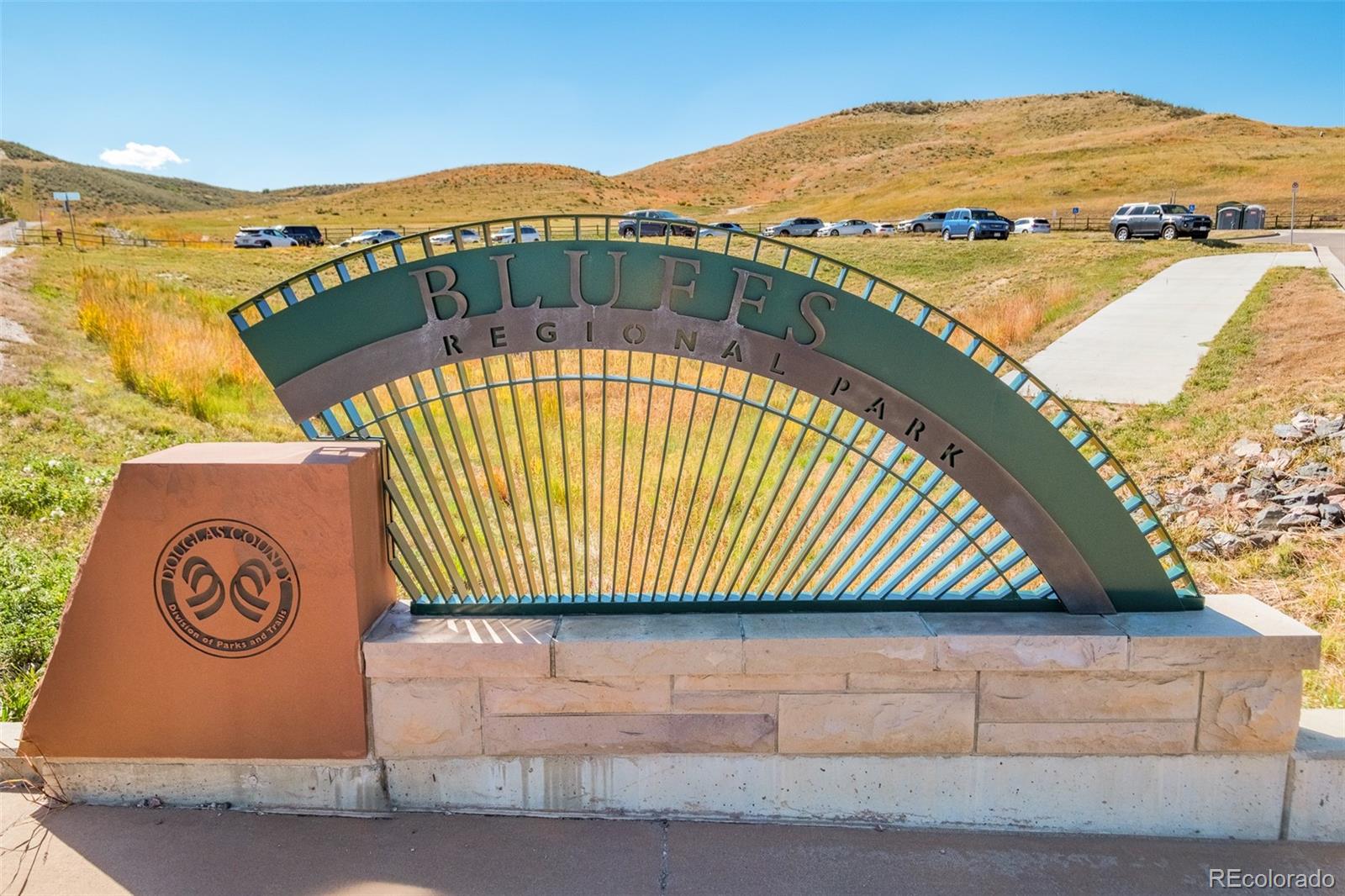 8176 Lone Oak Court Lone Tree, CO 80124 - Photo 45 of 50 a view of swimming pool with a garden and wooden fence
