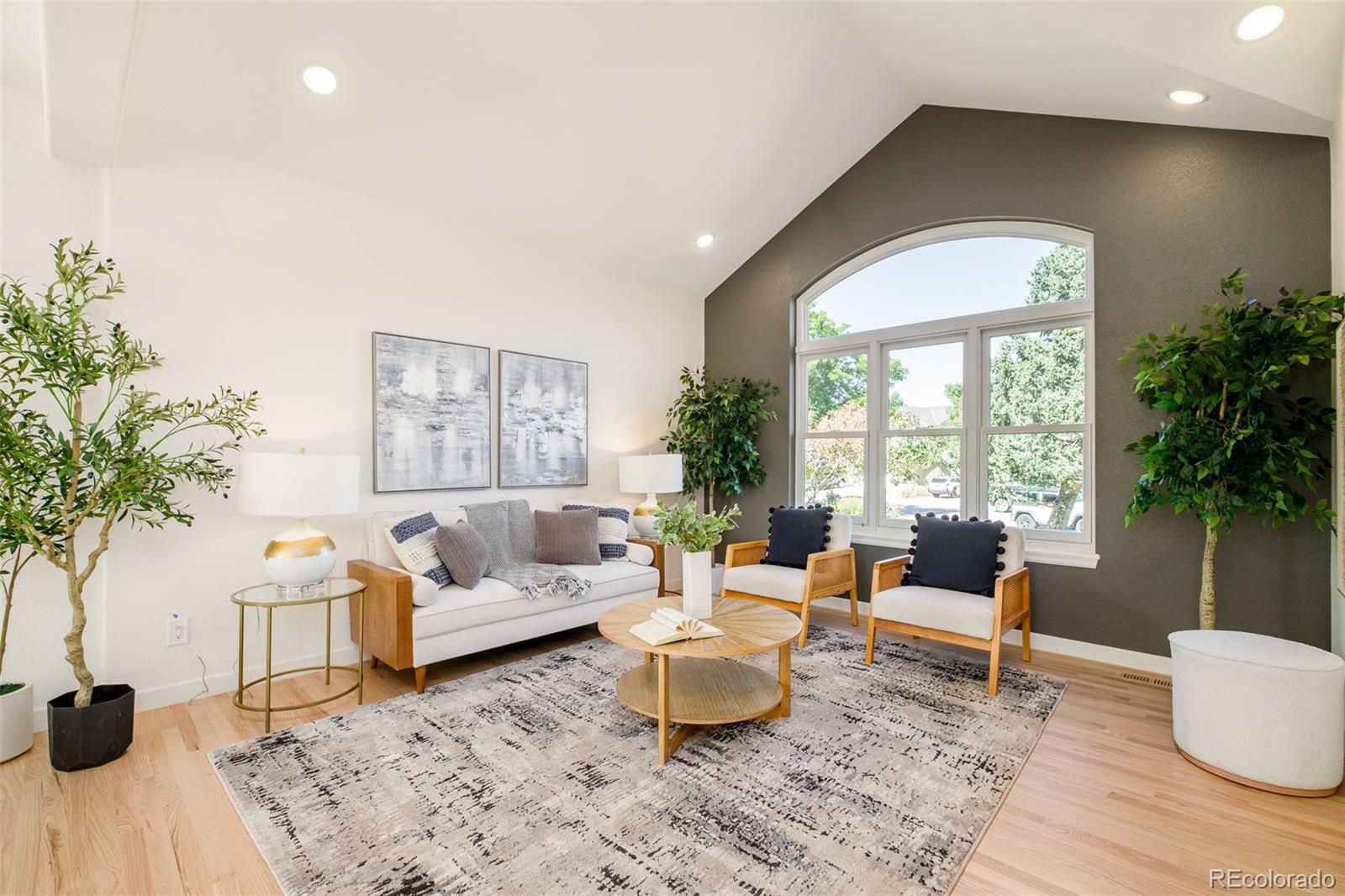 8176 Lone Oak Court Lone Tree, CO 80124 - Photo 5 of 50 a living room with furniture and a large window