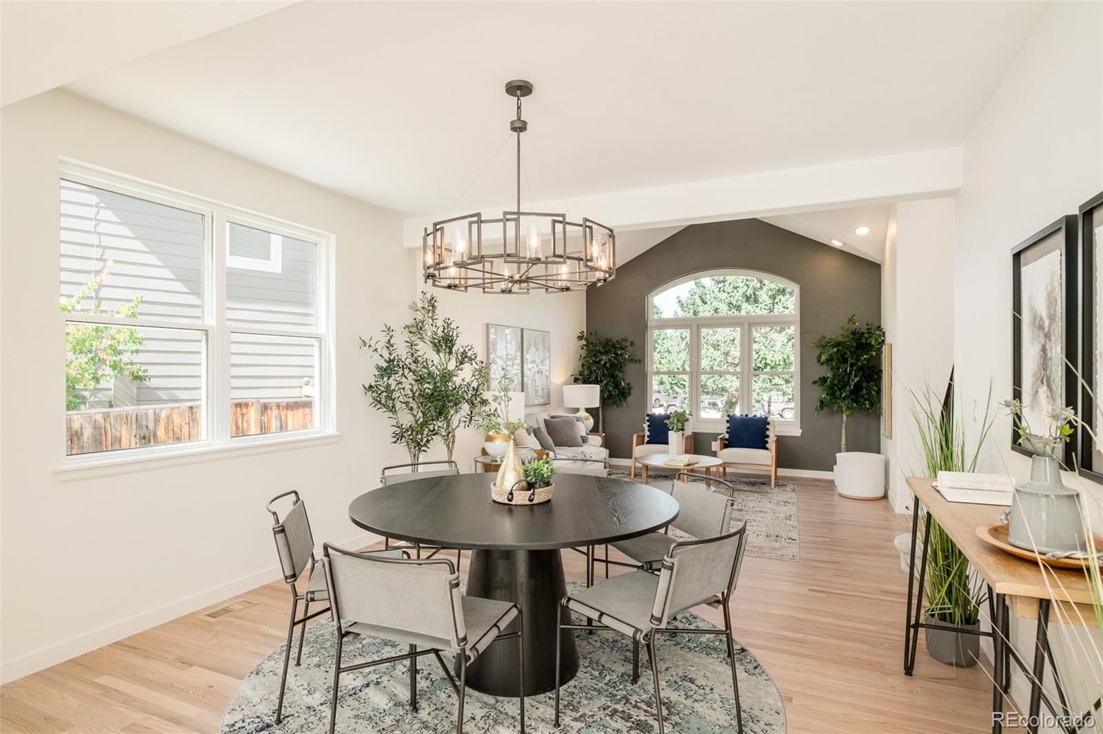 8176 Lone Oak Court Lone Tree, CO 80124 - Photo 6 of 50 a view of a dining room with furniture window and wooden floor