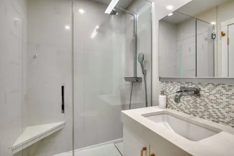 a bathroom with a sink and a shower