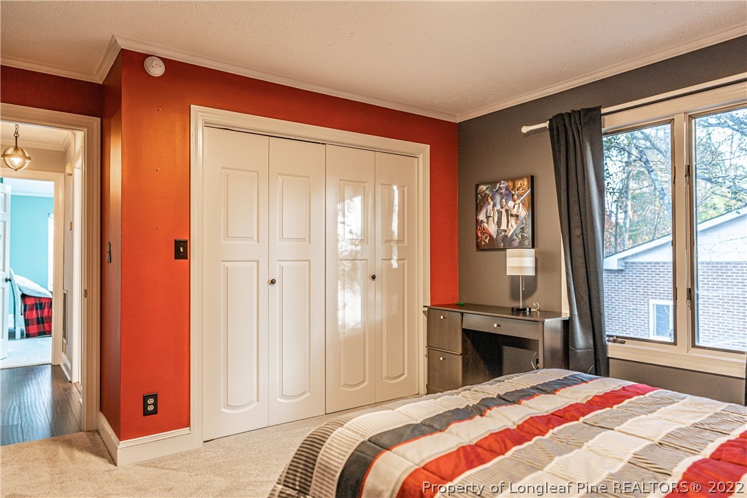 1075 Burning Tree Road Pinehurst, NC 28374 - Photo 15 of 25 a bedroom with a bed and a window