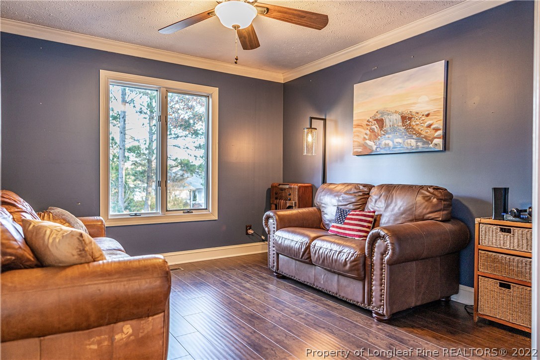 1075 Burning Tree Road Pinehurst, NC 28374 - Photo 4 of 25 a living room with furniture and a window