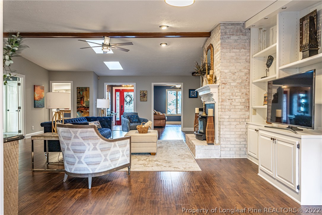 1075 Burning Tree Road Pinehurst, NC 28374 - Photo 5 of 25 a view of a dining room with furniture and wooden floor