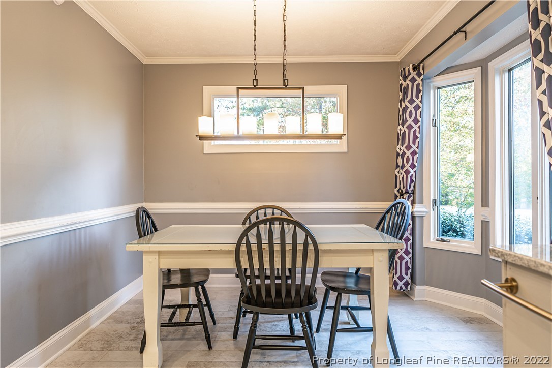 1075 Burning Tree Road Pinehurst, NC 28374 - Photo 9 of 25 a view of a dining room with furniture window and outside view