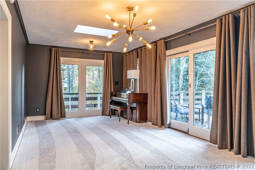 1075 Burning Tree Road Pinehurst, NC 28374 - Photo 10 of 25 a bedroom with a bed and a large window