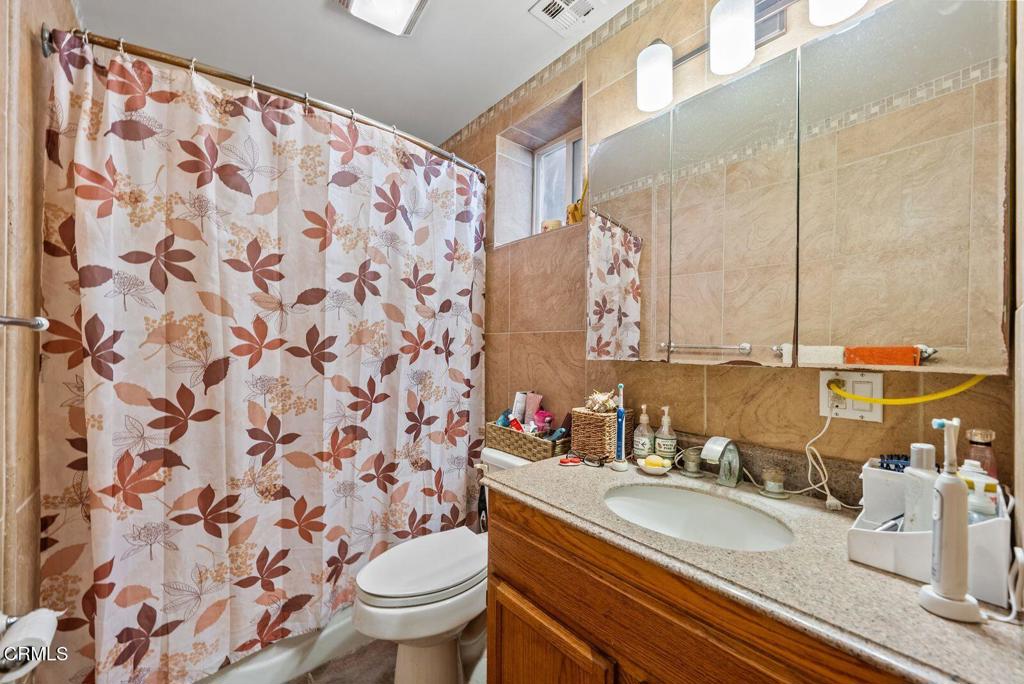 561 East Telegraph Road Fillmore, CA 93015 - Photo 12 of 29 a bathroom with a sink and a mirror