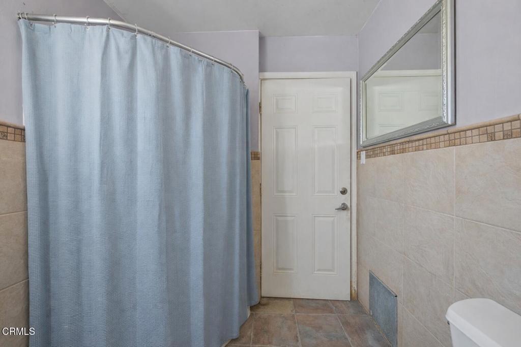 561 East Telegraph Road Fillmore, CA 93015 - Photo 16 of 29 a bathroom with a shower and a toilet