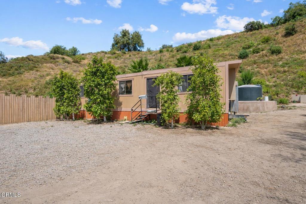 561 East Telegraph Road Fillmore, CA 93015 - Photo 17 of 29 a view of a house with backyard and trees