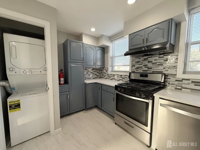a kitchen with a stove microwave and refrigerator
