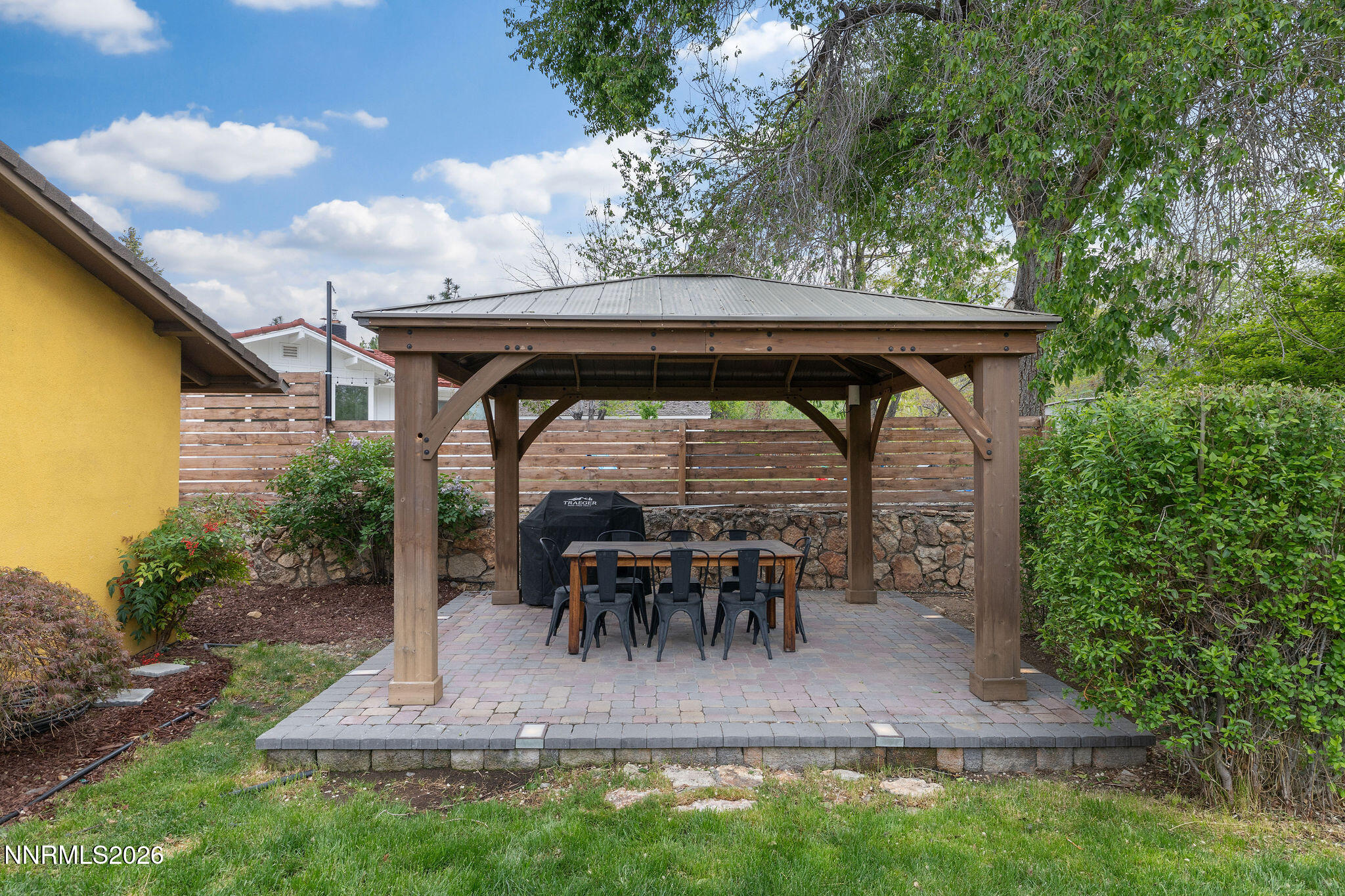 2785 Skyline Boulevard Reno, NV 89509 - Photo 40 of 65 a view of patio with table and chairs and potted plants with wooden fence
