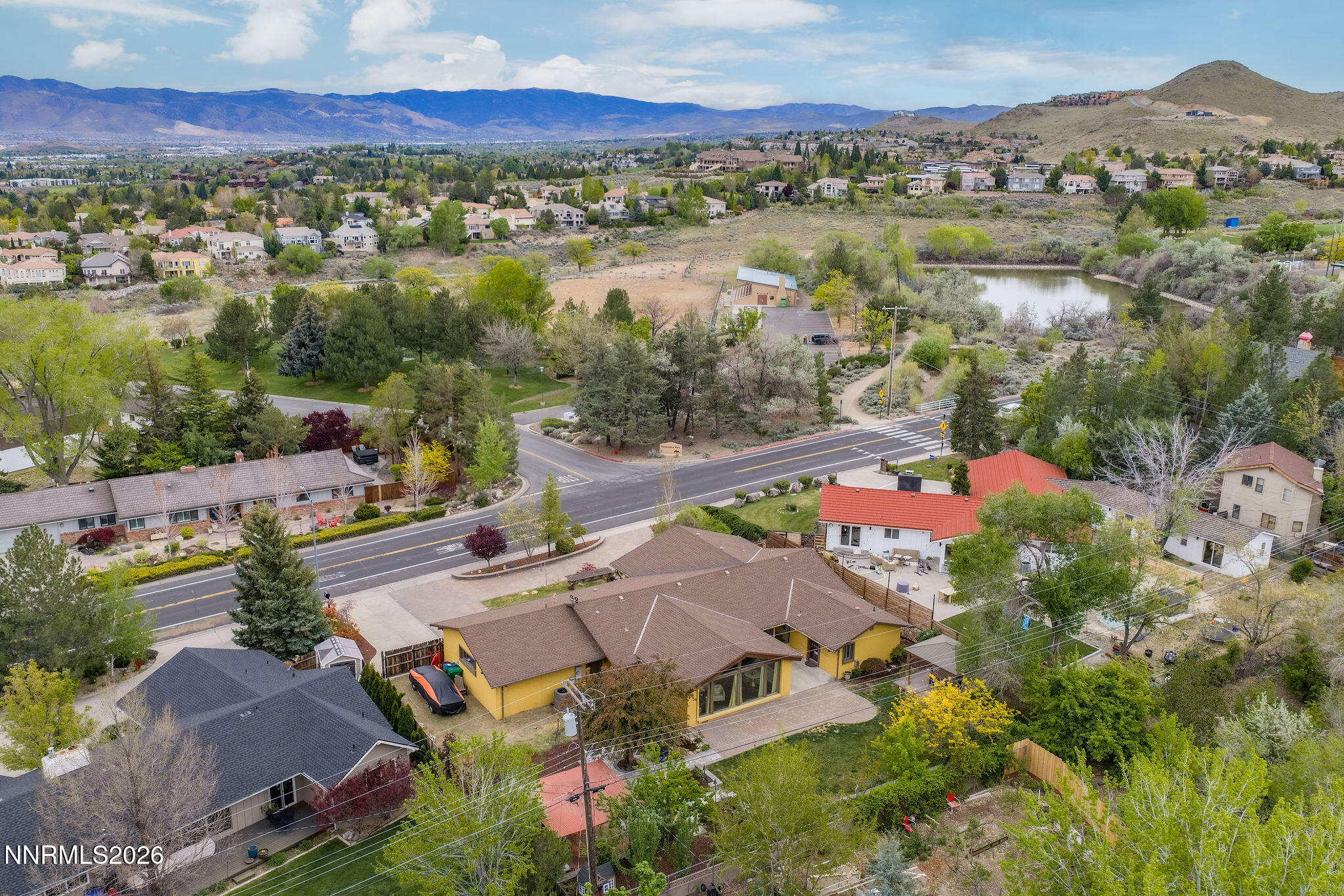 2785 Skyline Boulevard Reno, NV 89509 - Photo 49 of 65 an aerial view of a city with lots of residential buildings ocean and mountain view in back