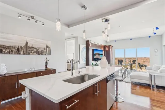 a large white kitchen with a large window