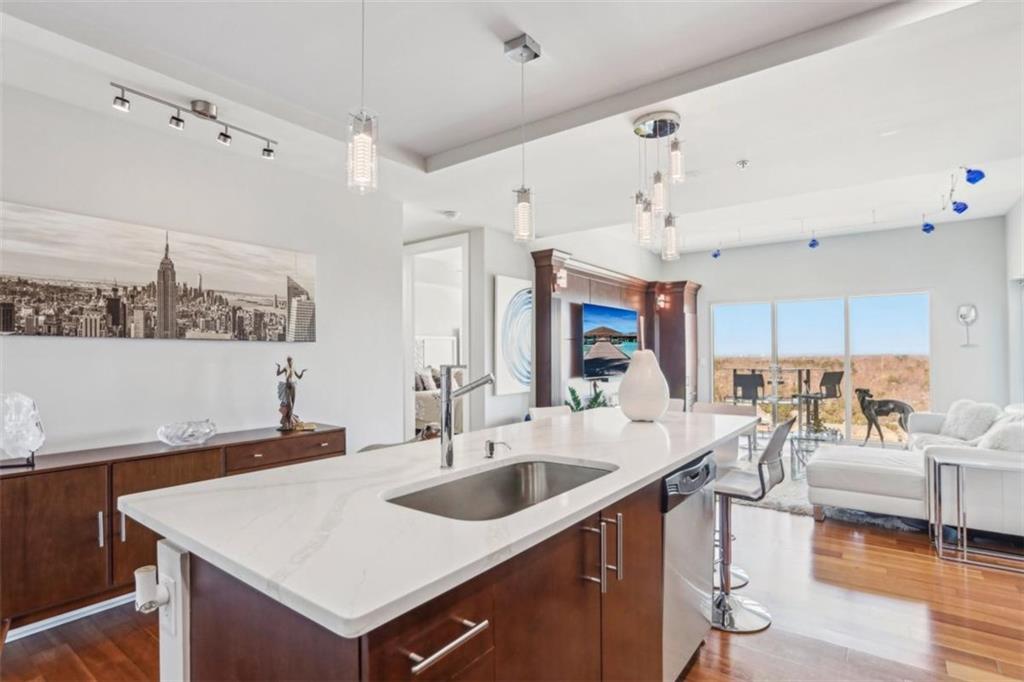 4561 Olde Perimeter Way, Unit 2609 Atlanta, GA 30346 - Photo 11 of 45 a large white kitchen with a large window