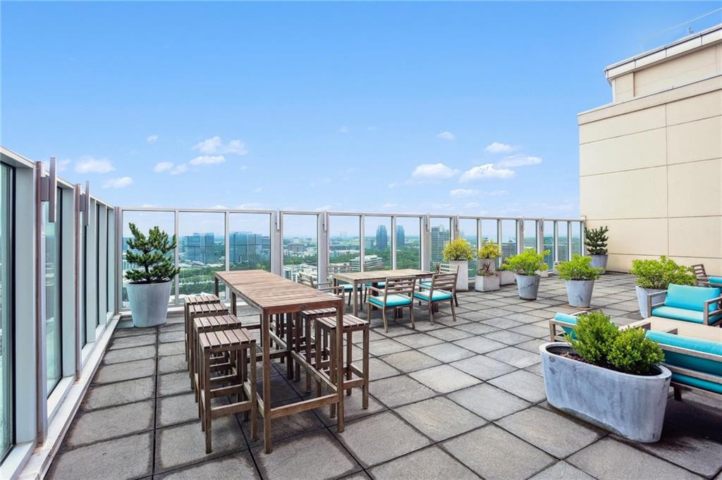 4561 Olde Perimeter Way, Unit 2609 Atlanta, GA 30346 - Photo 26 of 45 a view of a backyard with sitting area