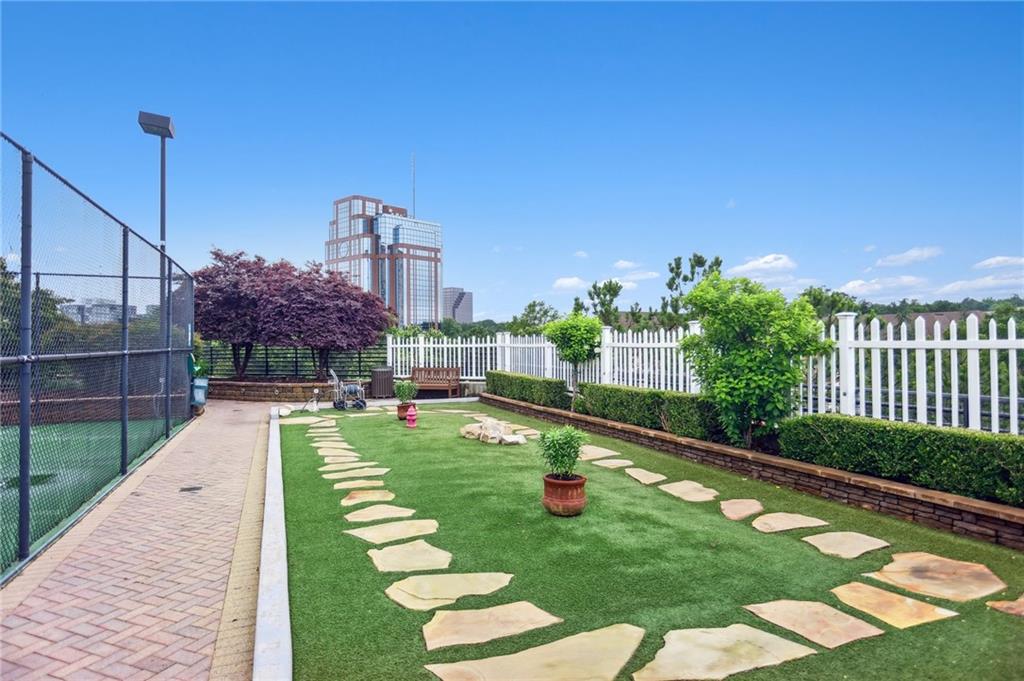 4561 Olde Perimeter Way, Unit 2609 Atlanta, GA 30346 - Photo 27 of 45 a view of a fountain in the backyard with a small pool