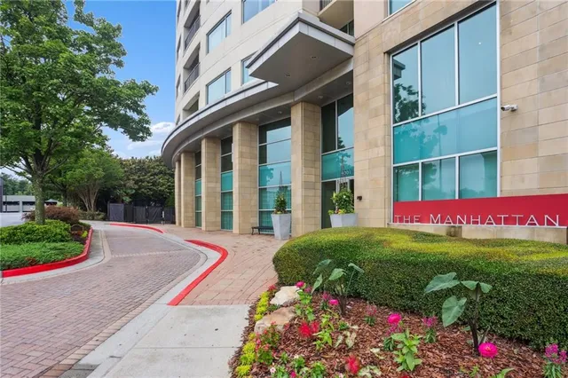 a view of a house with a yard and garden