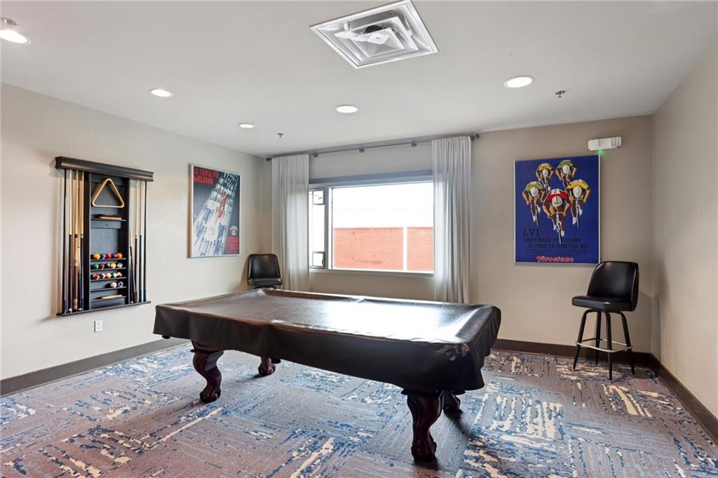 4561 Olde Perimeter Way, Unit 2609 Atlanta, GA 30346 - Photo 32 of 45 a living room with furniture