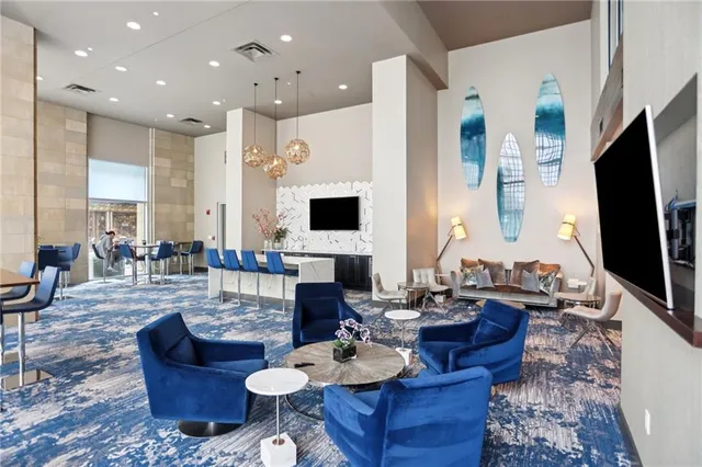 a living room with fireplace furniture and a flat screen tv