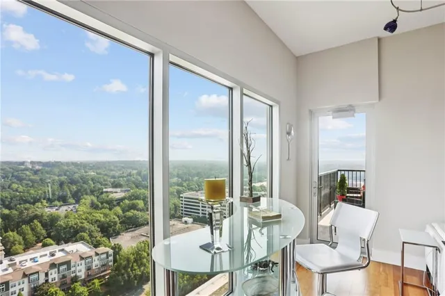 a view of a dining room with furniture window and outside view